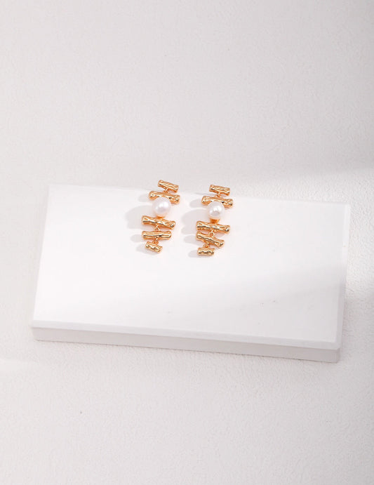Boucles d'oreilles délicates en perles géométriques