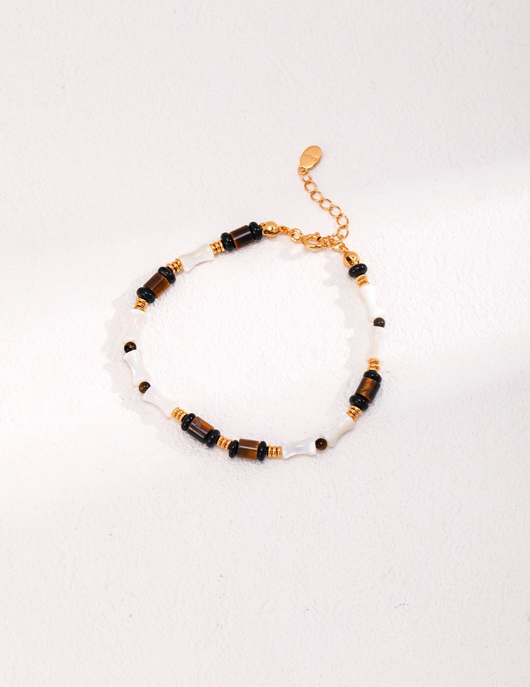 Armband aus Tigerauge-Stein und schwarzer Achat-Muschel