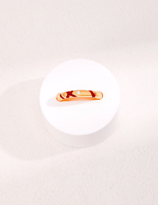 Bagues en or avec zircons rouges entrelacés