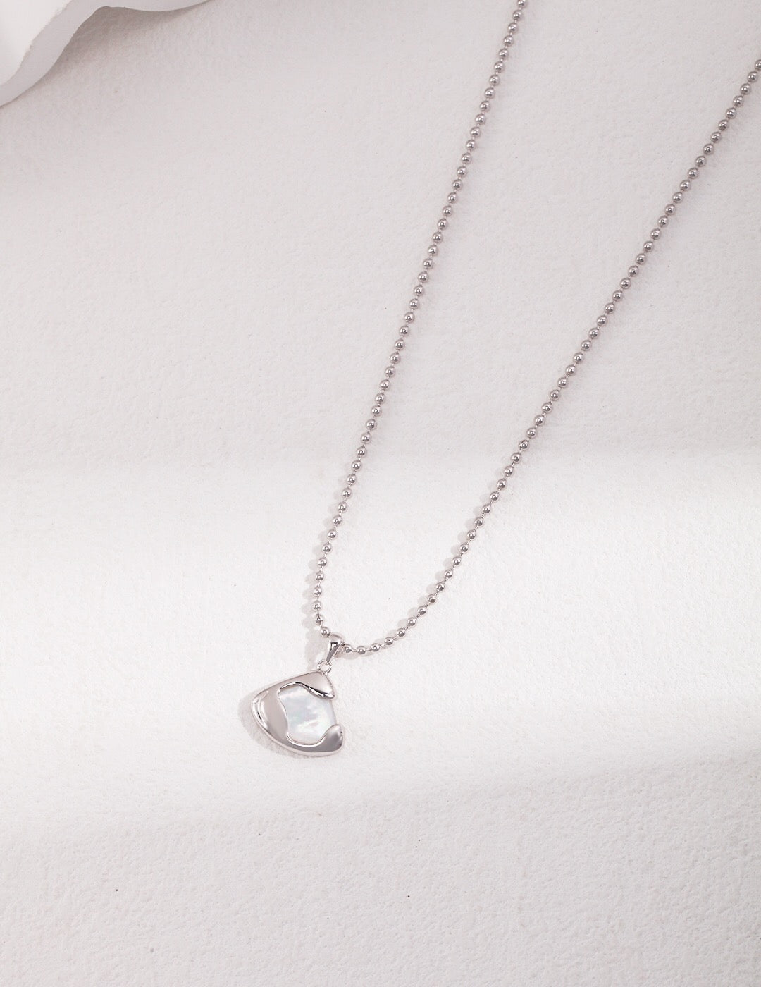 Elegant Mother of Pearl skirt pendant necklace close-up