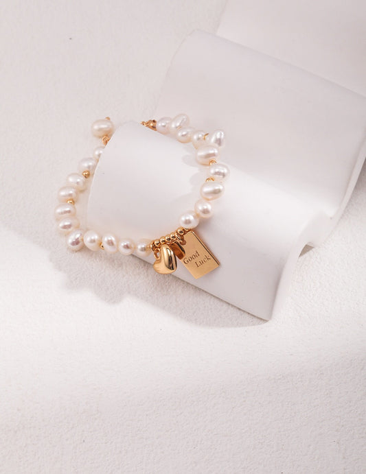 Bracelet porte-bonheur en perles d'eau douce gravées