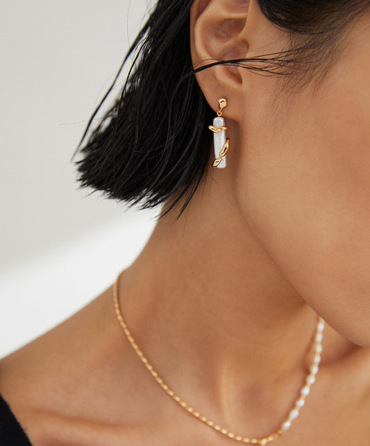 Model wearing Fernovia Design Twine Pillar Pearl Earrings