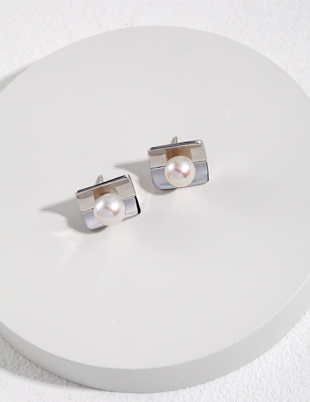 Macro view of square freshwater pearls – Fernovia Design studs in sterling silver