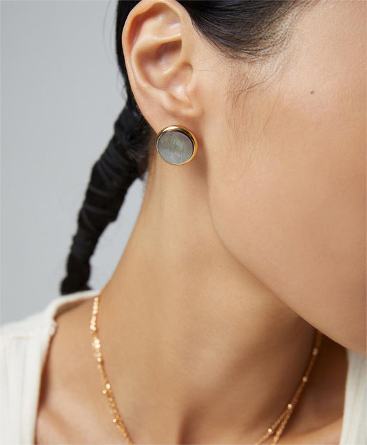 Fernovia Design black shell statement stud earrings worn on model