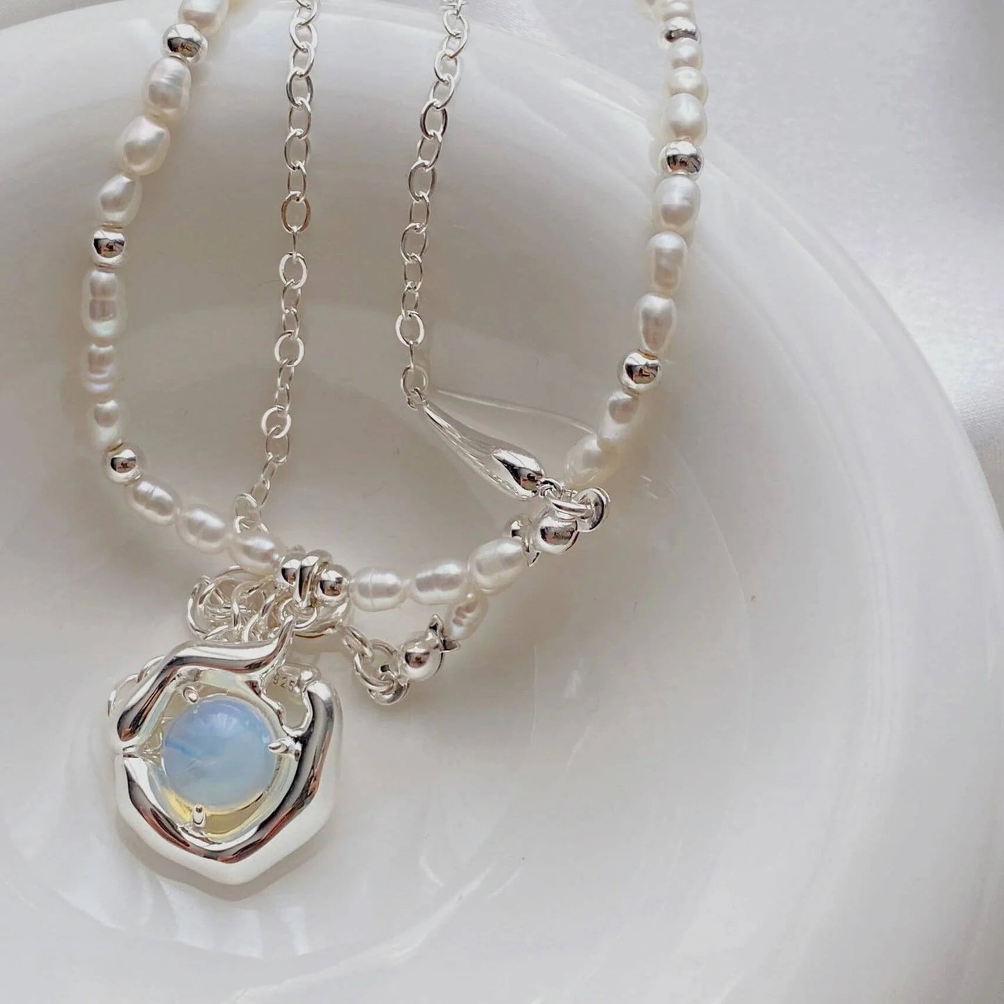Close-up of freshwater pearls and moonstone on sterling silver necklace, Fernovia Design