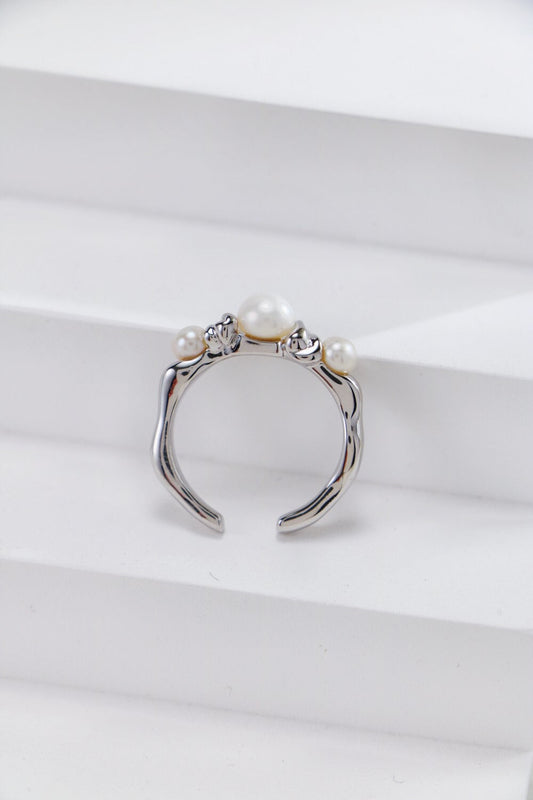 silver ring featuring three freshwater pearls, adjustable design