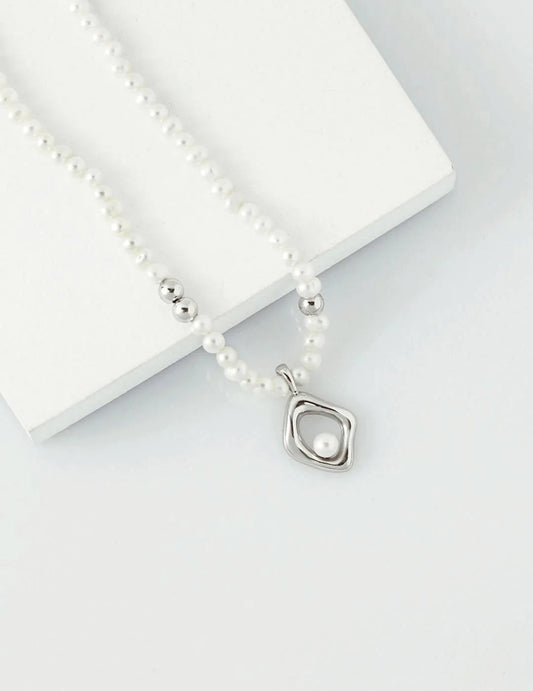 Handcrafted irregular pearl pendant necklace in sterling silver