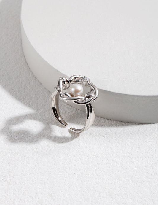 Product display: Fernovia Design twisted floral pearl ring in sterling silver, elegant craftsmanship